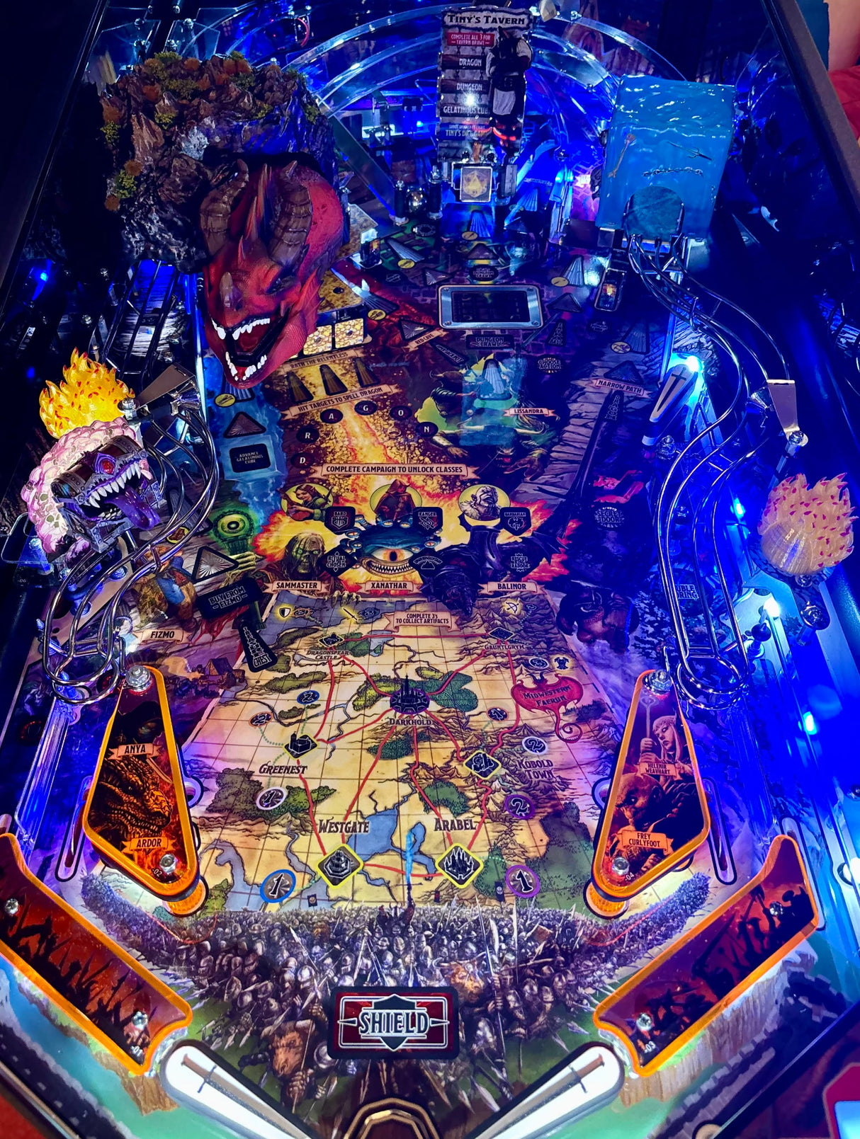Pinball machine with colorful design and various elements