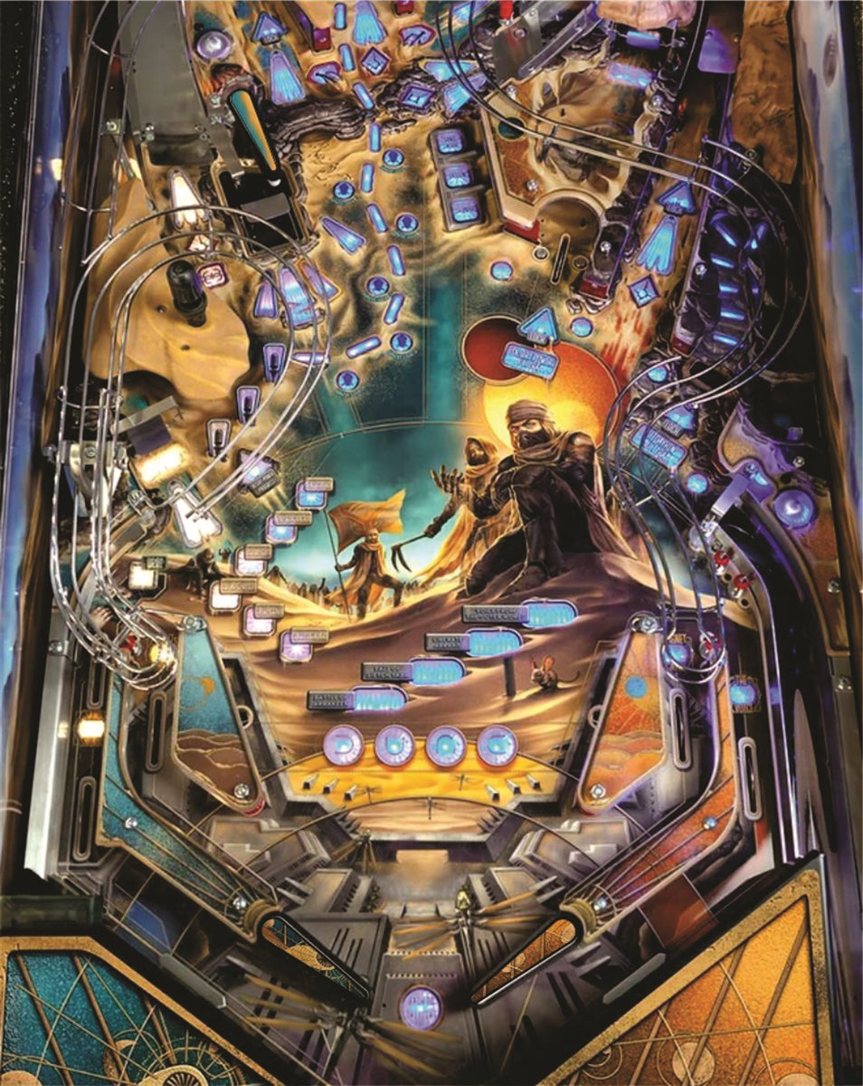 Close-up of a pinball machine with detailed artwork and lighting