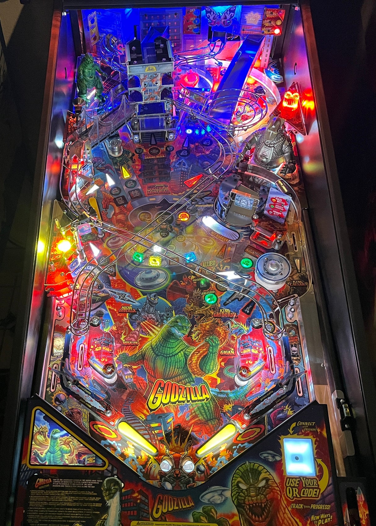 Pinball machine with colorful artwork and glowing lights
