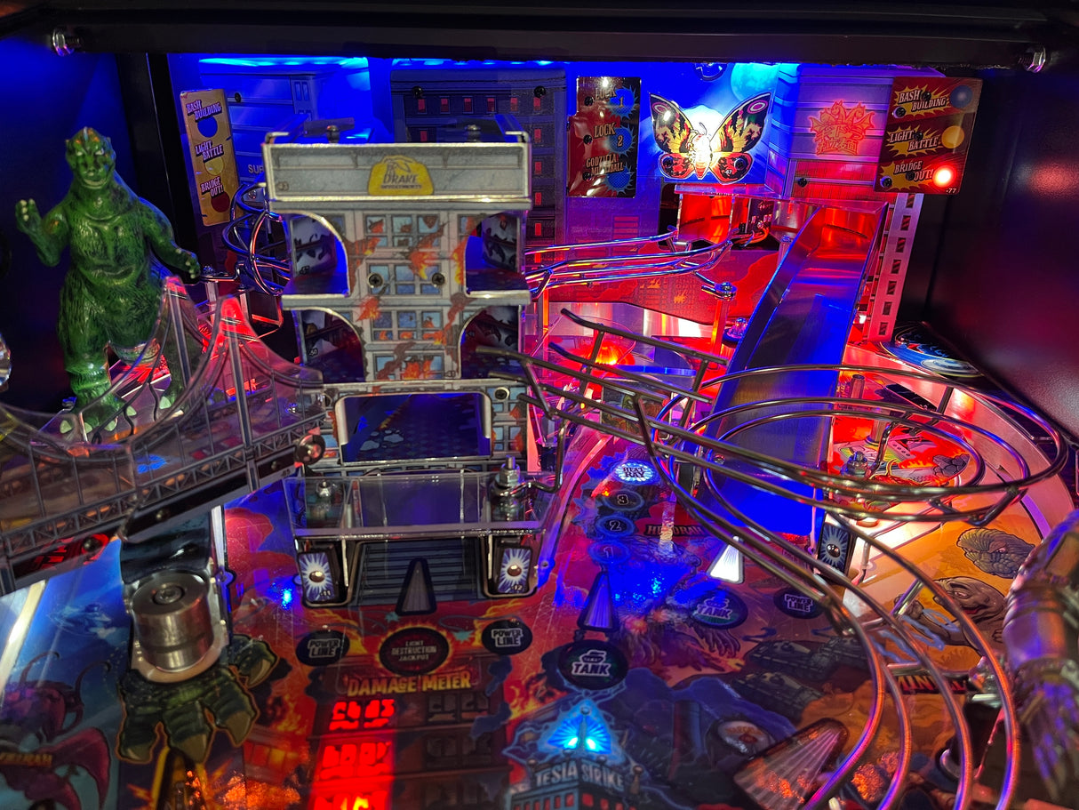Pinball machine with colorful lights and various game components
