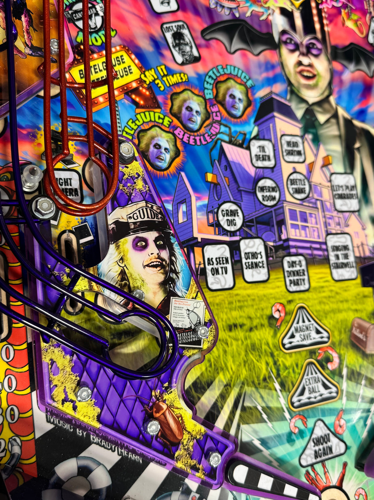 Wide view of the Beetlejuice playfield with the installed Betelgeuse left slingshot plastic.