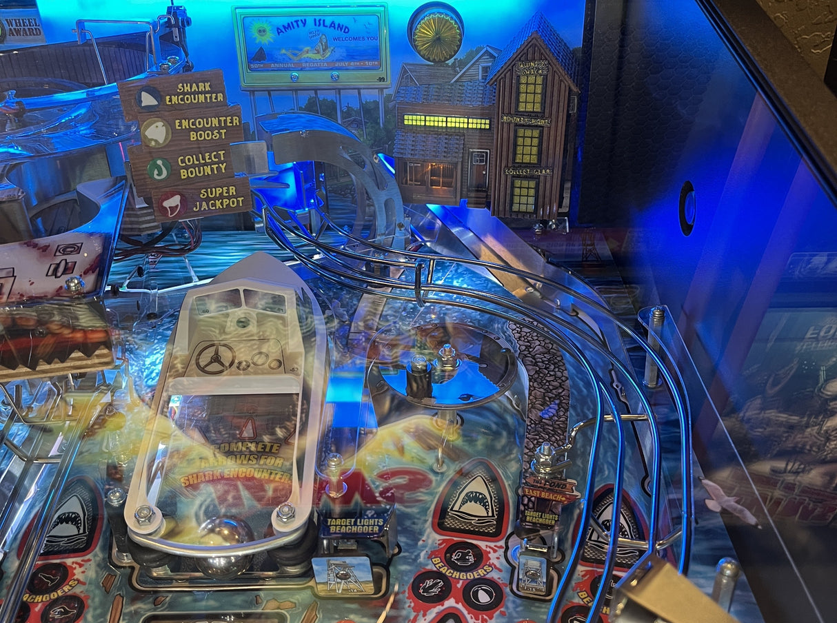Pinball machine with colorful lights and various game elements