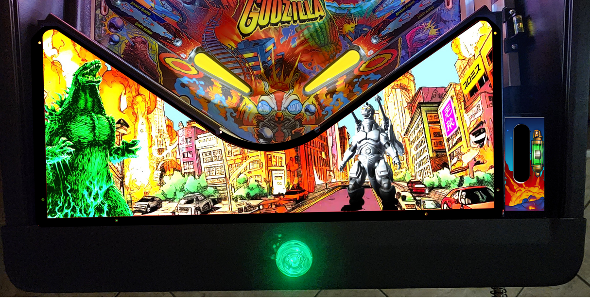 Pinball machine with colorful artwork featuring a green monster and cityscape.