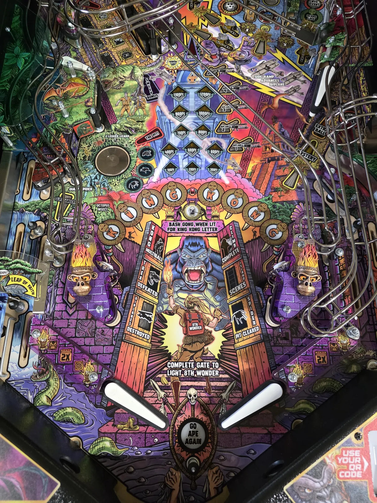 Colorful pinball machine with intricate design and various symbols