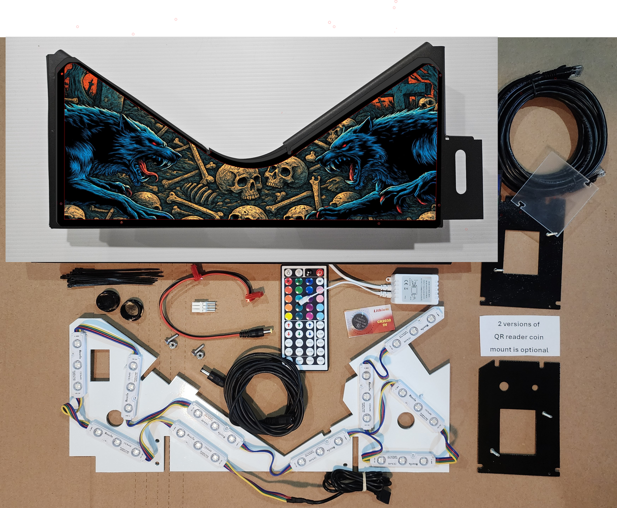 Pinball machine parts and components on a cardboard surface with a detailed artwork backdrop.