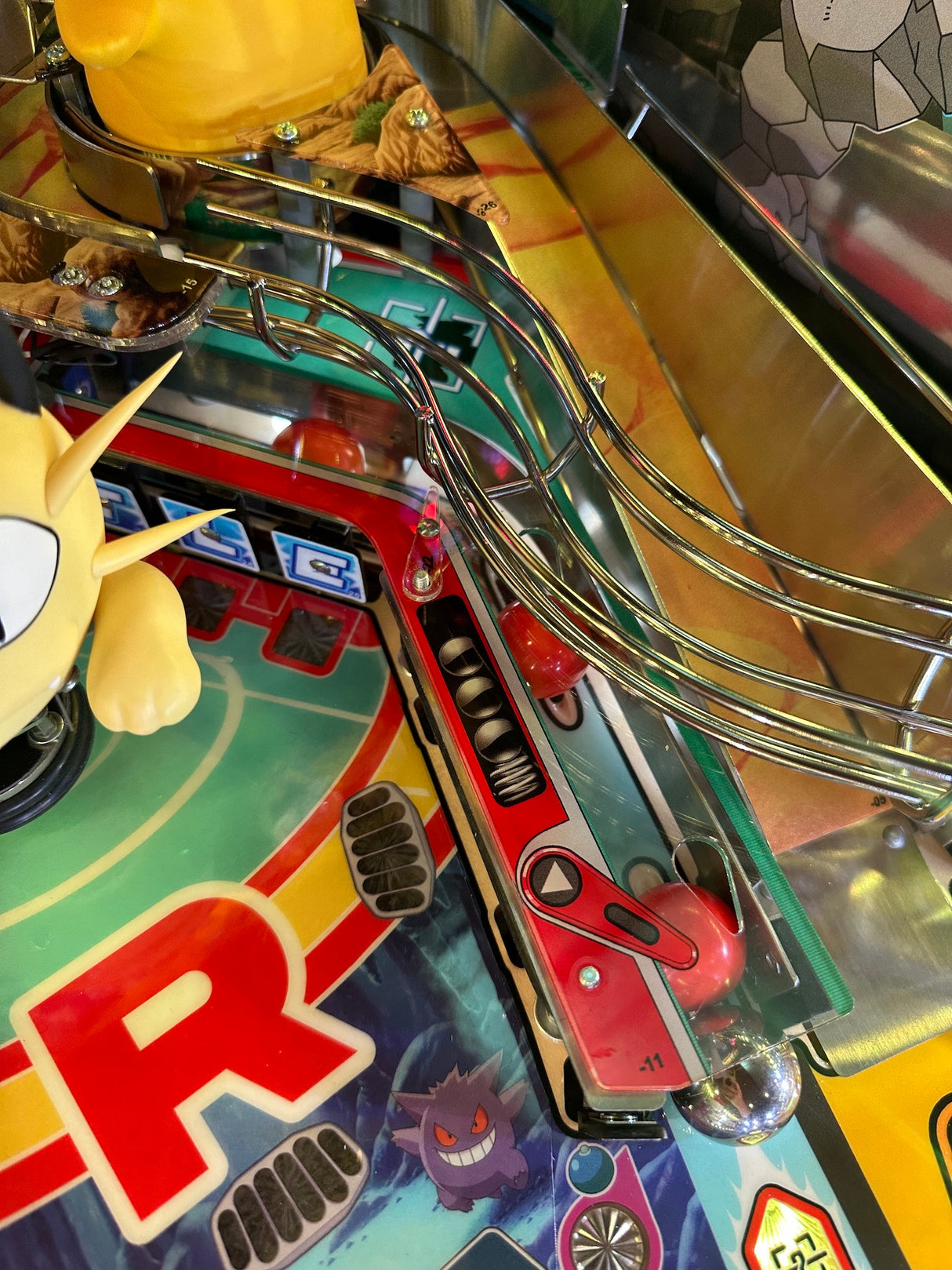 red pinballs on a Pokemon pinball machine
