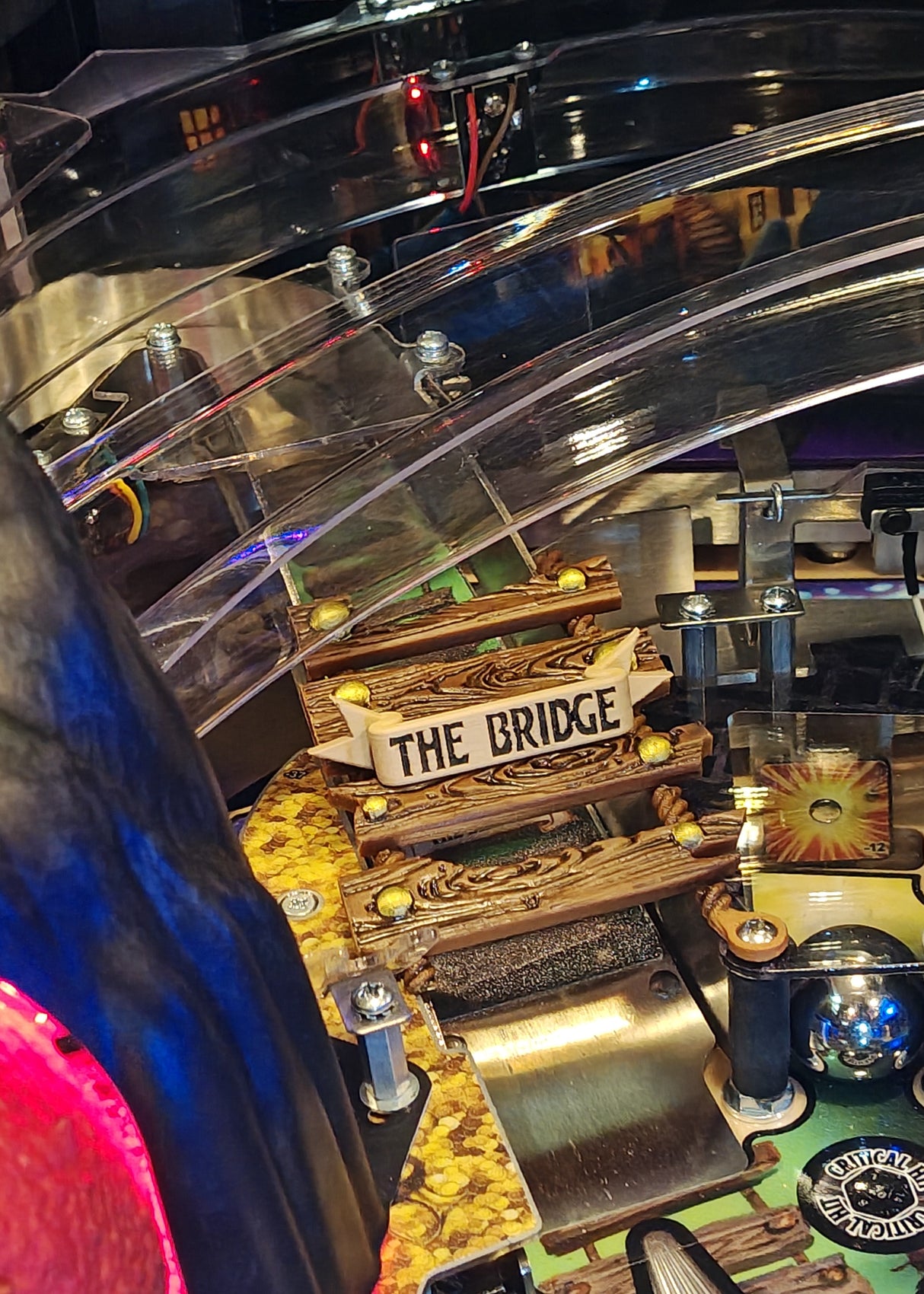 Pinball machine with 'The Bridge' sign and colorful playfield