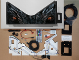 Pinball machine apron and Electronic components and parts on a cardboard surface 