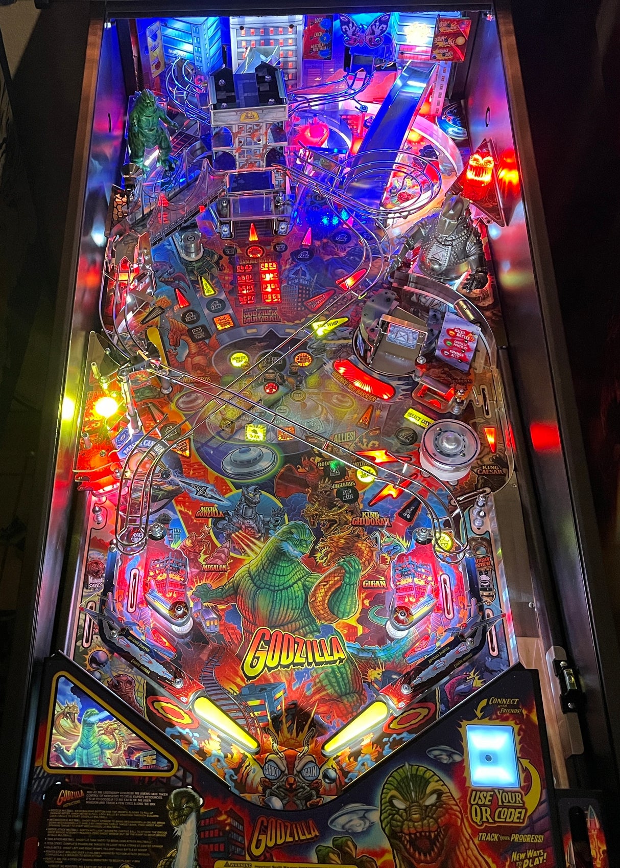 Pinball machine with colorful lights and 'Godzilla' branding