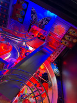 Close-up of a pinball machine with vibrant colors and intricate details.