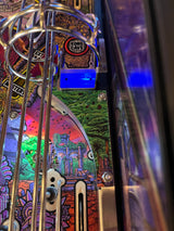 Close-up of a colorful pinball machine with 'Kong's Cave' label