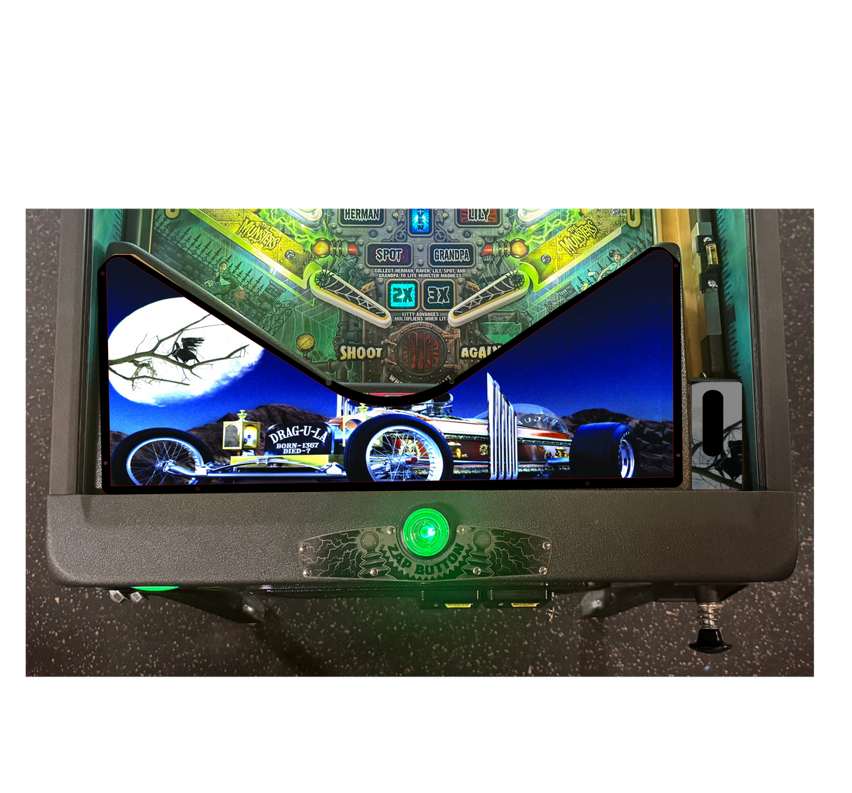 Pinball machine with digital display and green button on a white background