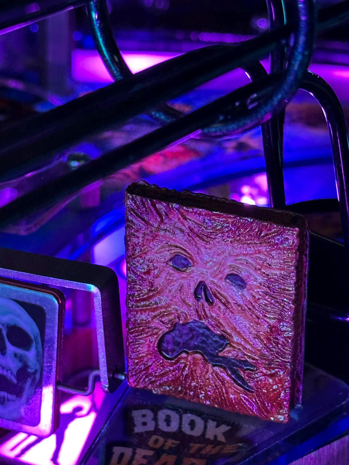 Glowing book with a face design on a dark background