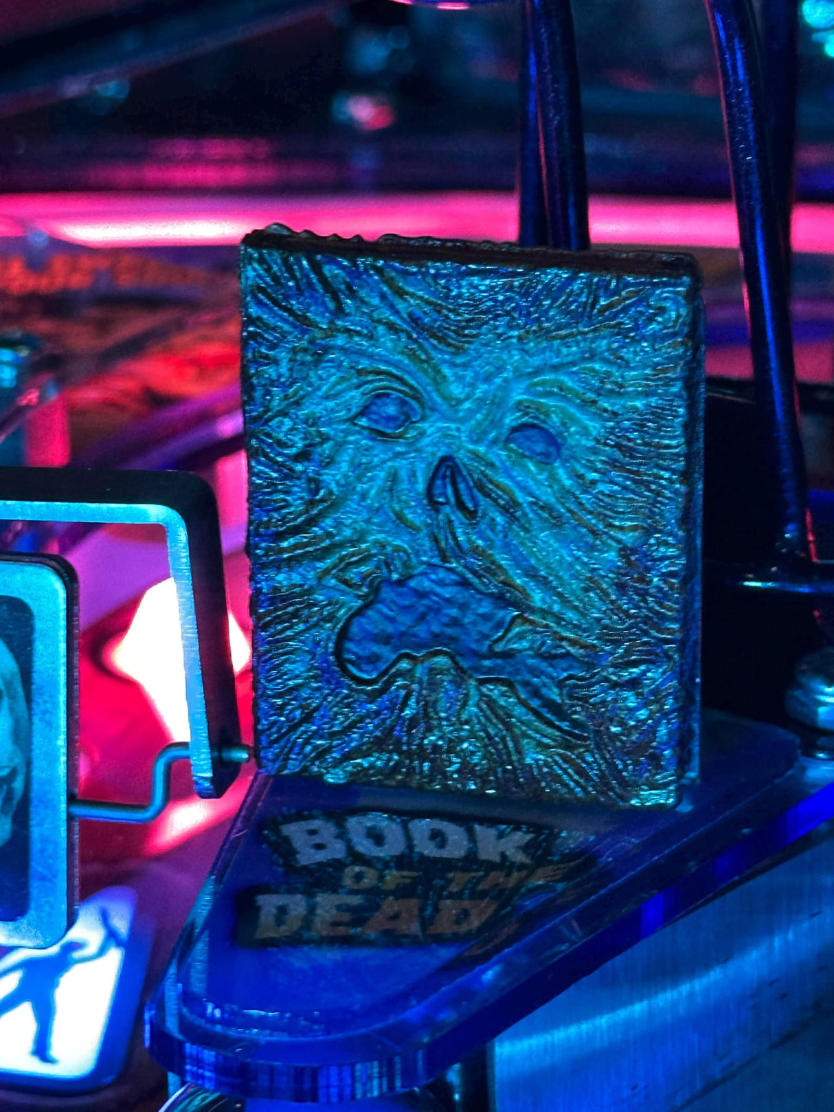 Glowing blue book with embossed design on a dark background