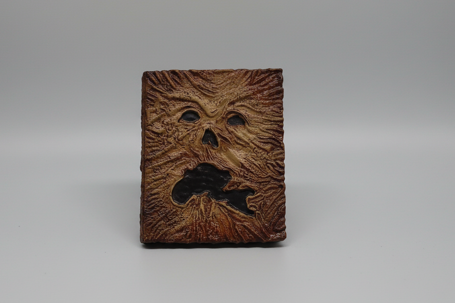 Wooden block with a textured face design on a gray background