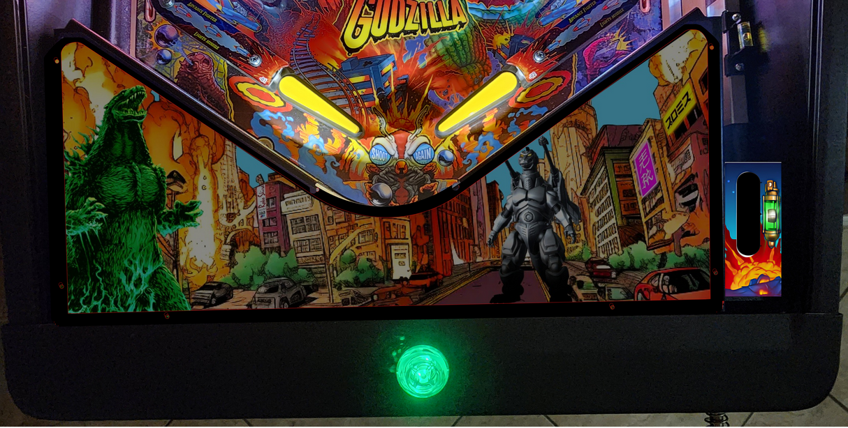 Pinball machine with 'Godzilla' theme featuring a green dinosaur and robot figure.