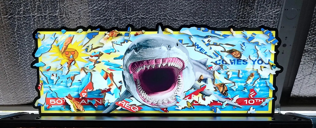 Shark-themed acrylic sign with colorful design on a wooden surface