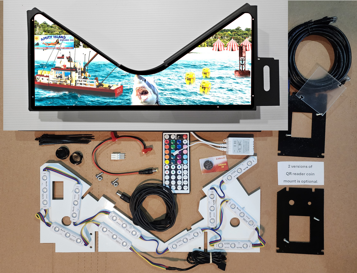 Pinball machine apron with a colorful shark theme and electronic parts on a brown background