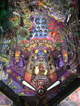 Colorful pinball machine with intricate design and various symbols