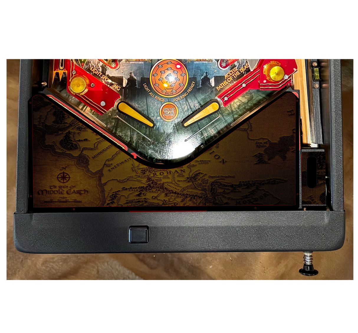 Pinball machine with detailed artwork on a wooden surface