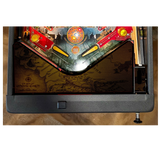Pinball machine with detailed artwork on a wooden surface