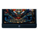 Pinball machine with dragon and skull design on a white background