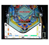 Monopoly-themed pinball machine with colorful design and gameboard layout.