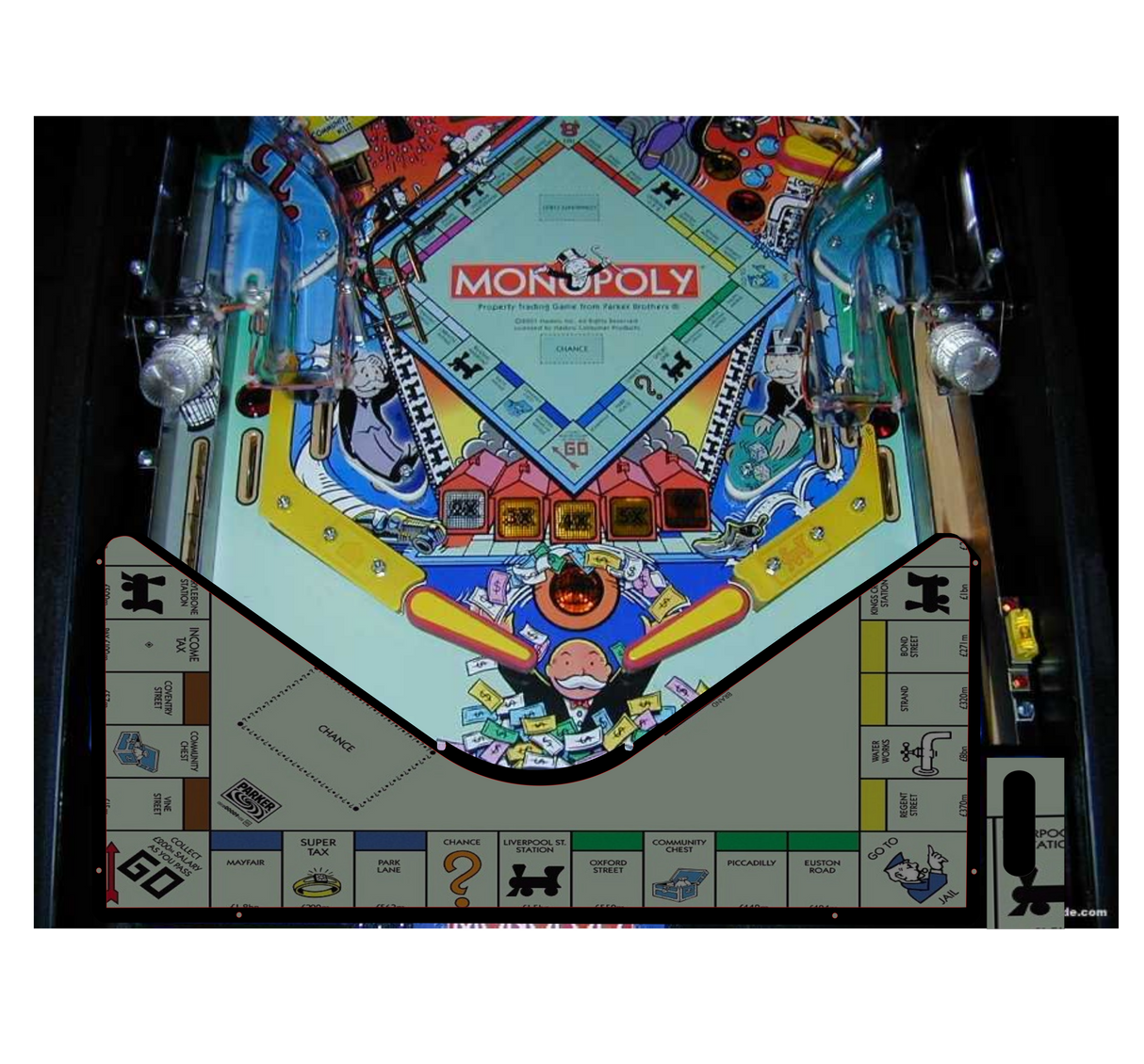 Monopoly pinball machine with colorful design and 'Monopoly' branding.