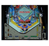 Monopoly pinball machine with colorful design and 'Monopoly' branding.