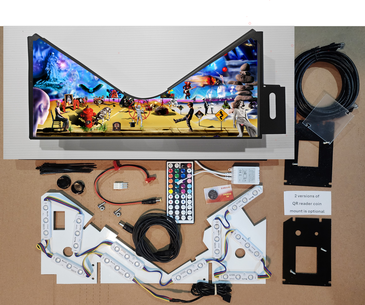 Pinball machine apron with colorful graphics and electronic parts on a brown background