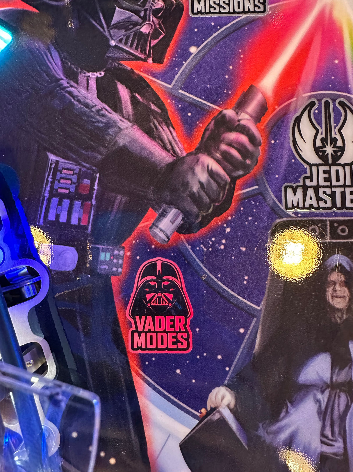 Star Wars-themed pinball machine with Darth Vader and Jedi Master design, featuring 'Vader Modes' text.