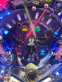 Star Wars-themed pinball machine with characters and symbols.