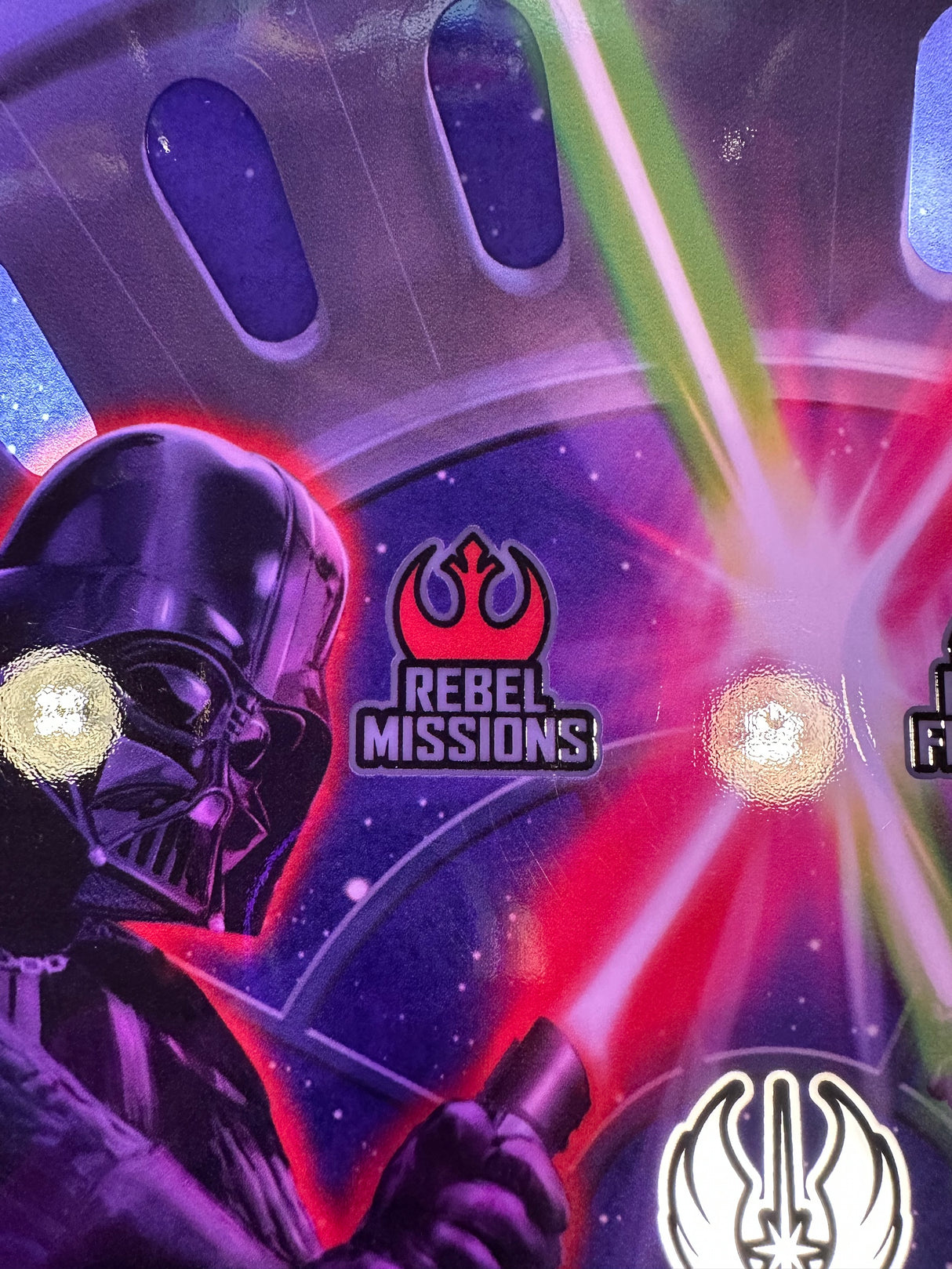 pinball machine with Darth Vader design and 'Rebel Missions' branding on a colorful background.