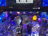 Pinball machine with Star Wars-themed figures and a digital display showing '15,000,000' in the background.