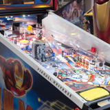 pinball machine with protective plastic on the sides